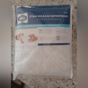 Sealy waterproof crib pad- NEW